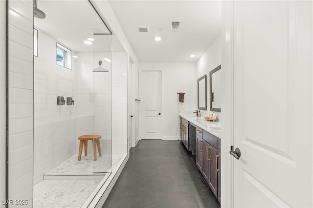 389 Red Feather Peak Ct, Las Vegas, NV 89138 - bathroom with double vanity, a tile shower, and recessed lighting