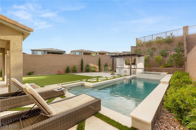 389 Red Feather Peak Ct, Las Vegas, NV 89138 - view of swimming pool featuring a patio area, a fenced backyard, and an outdoor kitchen