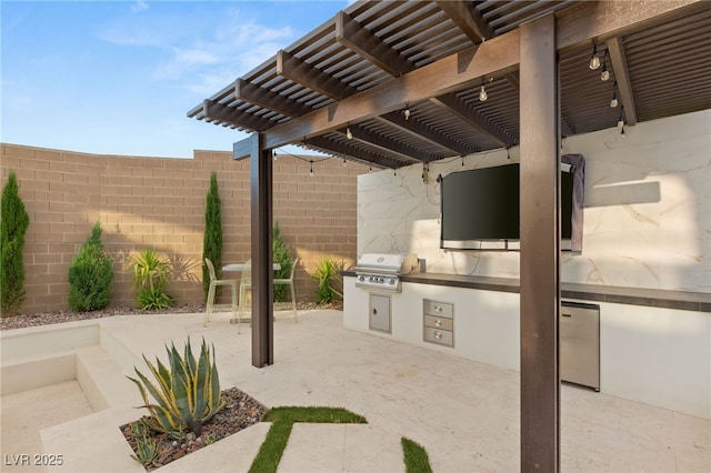 389 Red Feather Peak Ct, Las Vegas, NV 89138 - view of patio featuring an outdoor kitchen and a pergola