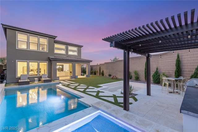 389 Red Feather Peak Ct, Las Vegas, NV 89138 - back of house with a pergola, stucco siding, a patio, and a fenced backyard