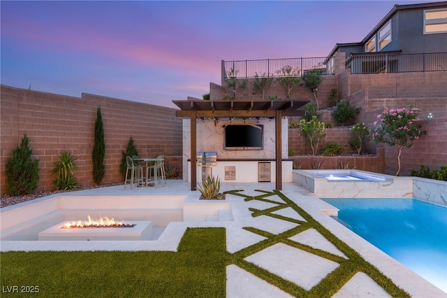 389 Red Feather Peak Ct, Las Vegas, NV 89138 - view of swimming pool with a fire pit, an in-ground hot tub, a patio area, and exterior kitchen