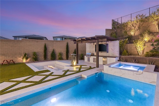 389 Red Feather Peak Ct, Las Vegas, NV 89138 - pool at dusk featuring an outdoor kitchen, an in-ground hot tub, a patio area, and a fenced backyard