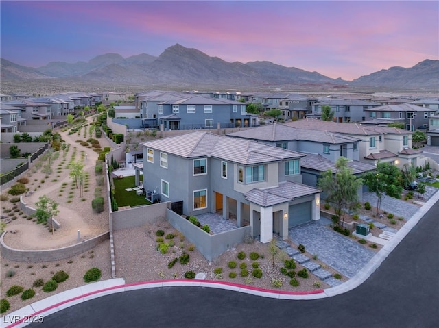 389 Red Feather Peak Ct, Las Vegas, NV 89138 - aerial view at dusk of a residential view and a mountain view
