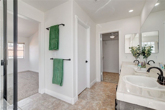 6652 Coral Springs Cir, Las Vegas, NV 89108 - full bathroom featuring double vanity, a walk in closet, and tile patterned floors