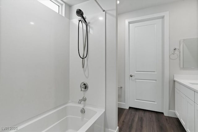 64 Lake Oasis St, Henderson, NV 89011 - bathroom with tub / shower combination, vanity, and wood finished floors