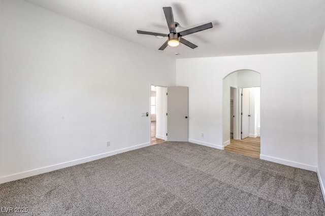 6456 First View Ave, Las Vegas, NV 89142 - empty room featuring carpet floors, arched walkways, and a ceiling fan