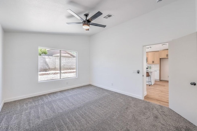 6456 First View Ave, Las Vegas, NV 89142 - empty room with light carpet and a ceiling fan