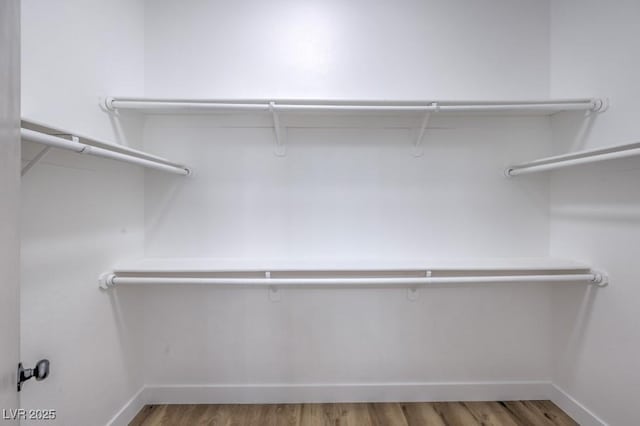 6456 First View Ave, Las Vegas, NV 89142 - walk in closet featuring wood finished floors