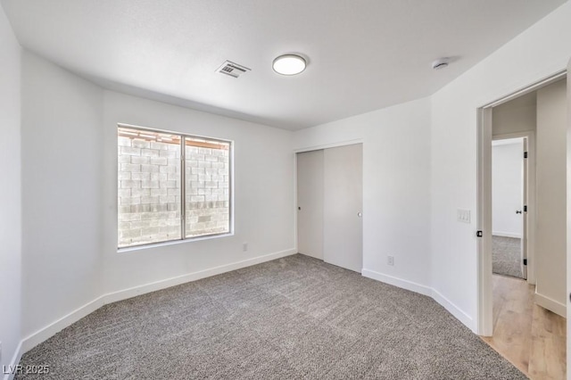 6456 First View Ave, Las Vegas, NV 89142 - unfurnished bedroom with light colored carpet and a closet