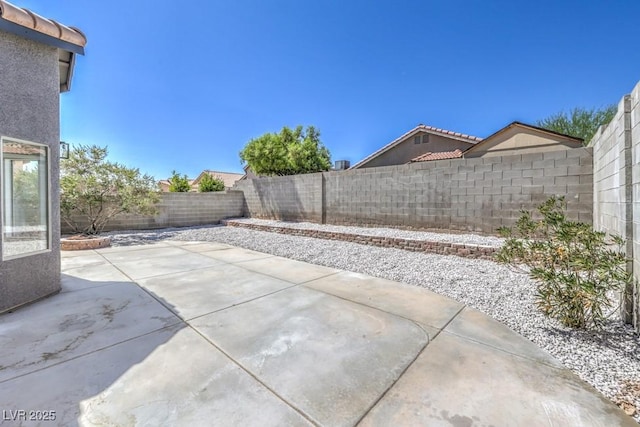 6456 First View Ave, Las Vegas, NV 89142 - fenced backyard with a patio