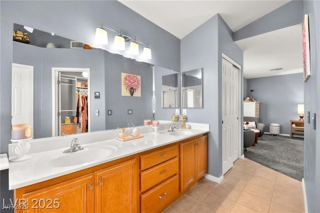 262 Cielito Lindo St, Henderson, NV 89012 - full bathroom featuring double vanity, tile patterned floors, and a walk in closet