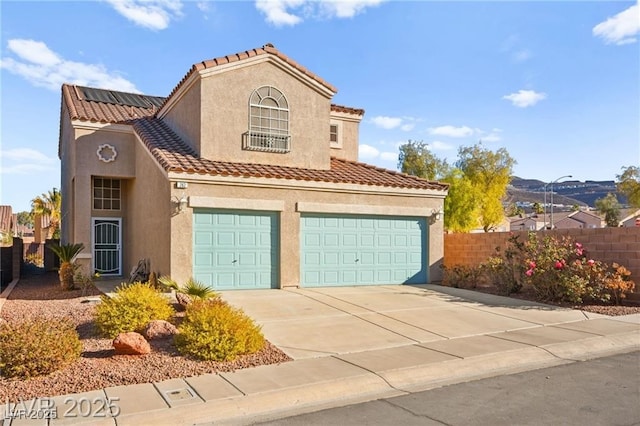 262 Cielito Lindo St, Henderson, NV 89012 - mediterranean / spanish-style home with stucco siding, driveway, a tiled roof, and a garage