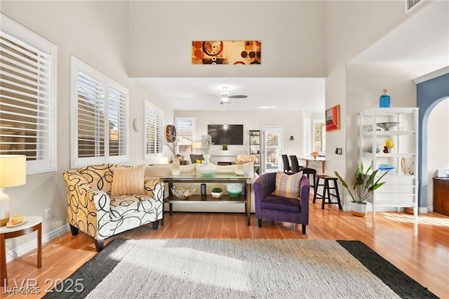 262 Cielito Lindo St, Henderson, NV 89012 - living room featuring wood finished floors, a ceiling fan, and a towering ceiling