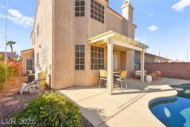 262 Cielito Lindo St, Henderson, NV 89012 - back of house featuring stucco siding, a patio area, a chimney, and a pergola