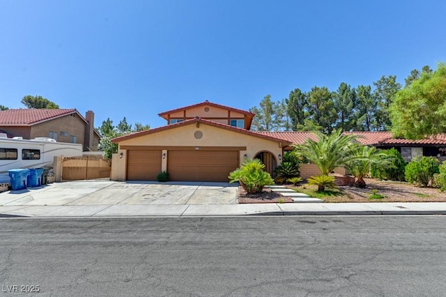 8729 Pesaro Dr, Las Vegas, NV 89117 - mediterranean / spanish-style house featuring stucco siding, an attached garage, driveway, and a tiled roof