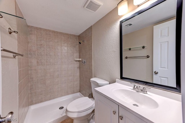 8729 Pesaro Dr, Las Vegas, NV 89117 - full bathroom featuring a textured wall, vanity, and a tile shower