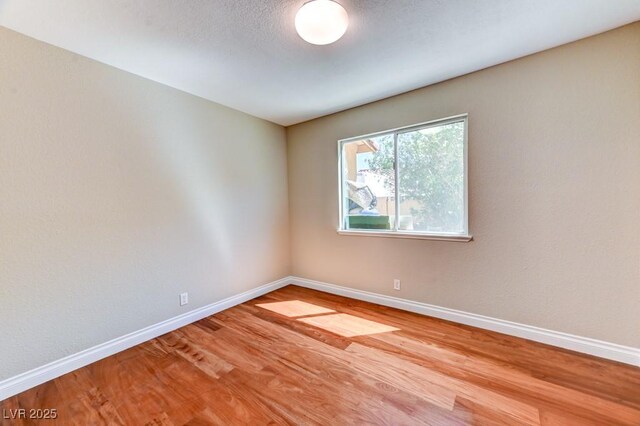 8729 Pesaro Dr, Las Vegas, NV 89117 - spare room with wood finished floors and baseboards