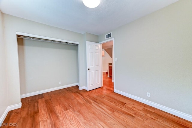 8729 Pesaro Dr, Las Vegas, NV 89117 - unfurnished bedroom with light wood-style floors and a closet
