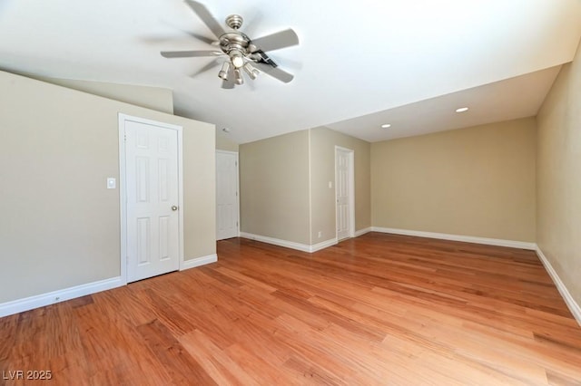 8729 Pesaro Dr, Las Vegas, NV 89117 - empty room featuring light wood-style floors, ceiling fan, and lofted ceiling