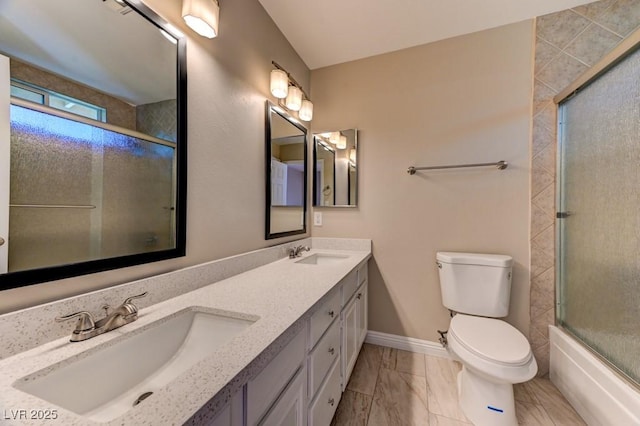 8729 Pesaro Dr, Las Vegas, NV 89117 - bathroom featuring double vanity, marble look tiles, and bath / shower combo with glass door