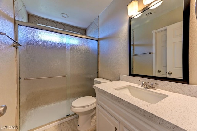 8729 Pesaro Dr, Las Vegas, NV 89117 - full bathroom featuring vanity, a shower stall, and a textured wall