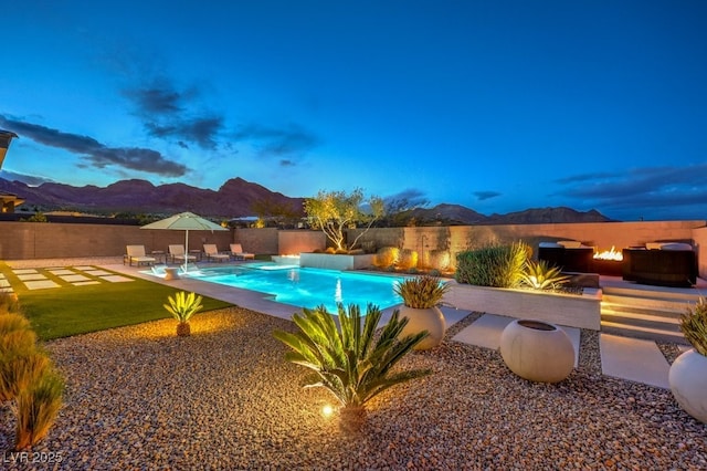 12544 Claymore Highland Ave, Las Vegas, NV 89138 - view of swimming pool featuring a mountain view, a fenced backyard, and a patio area