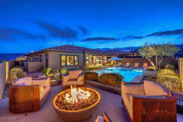 12544 Claymore Highland Ave, Las Vegas, NV 89138 - view of pool featuring a patio, an outdoor living space with a fire pit, and a fenced backyard