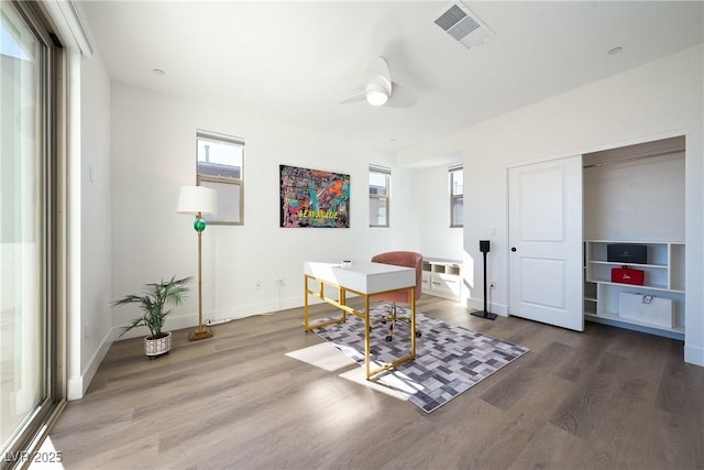 2722 Marchetti Pl, Henderson, NV 89044 - dining area with healthy amount of natural light, wood finished floors, and a desk
