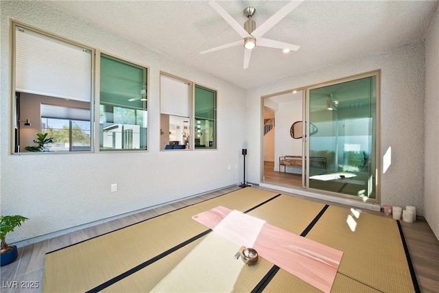 2722 Marchetti Pl, Henderson, NV 89044 - workout room with wood finished floors, ceiling fan, and bowling