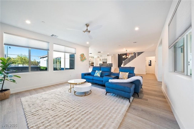 2722 Marchetti Pl, Henderson, NV 89044 - living area with light wood finished floors, ceiling fan, recessed lighting, a chandelier, and stairway