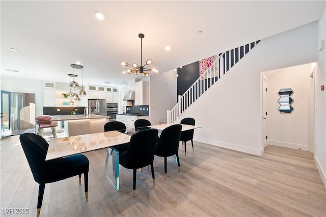 2722 Marchetti Pl, Henderson, NV 89044 - dining area featuring a chandelier, light wood-style flooring, and recessed lighting