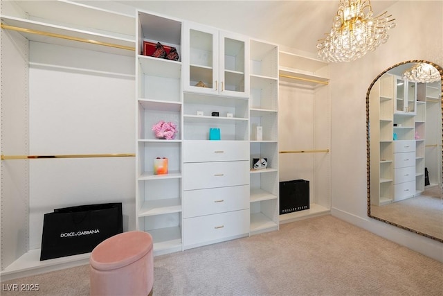2722 Marchetti Pl, Henderson, NV 89044 - walk in closet with a chandelier, carpet flooring, and arched walkways