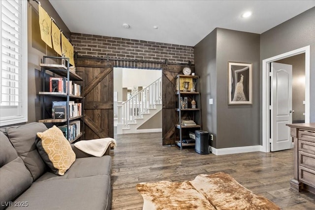 364 Trentino Alto St, Henderson, NV 89012 - living room with wood finished floors, stairway, brick wall, and recessed lighting