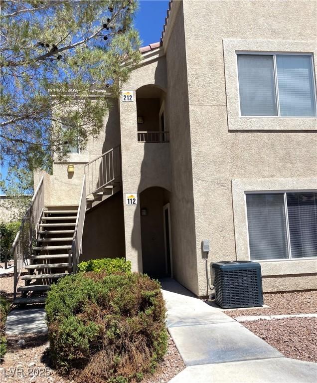 9470 Peace Way Unit 212, Las Vegas, NV 89147 - view of building exterior with stairs