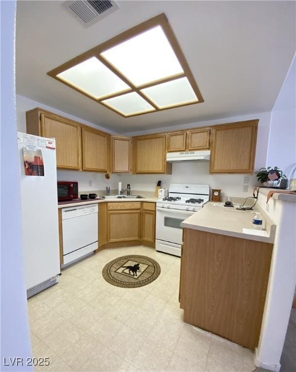 9470 Peace Way Unit 212, Las Vegas, NV 89147 - kitchen with white appliances, under cabinet range hood, light countertops, and light floors