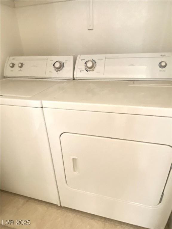9470 Peace Way Unit 212, Las Vegas, NV 89147 - laundry area featuring washer and dryer and light tile patterned flooring