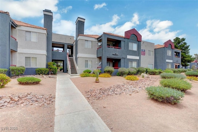 8600 W Charleston Blvd Unit 1059, Las Vegas, NV 89117 - view of building exterior with a residential view and stairs