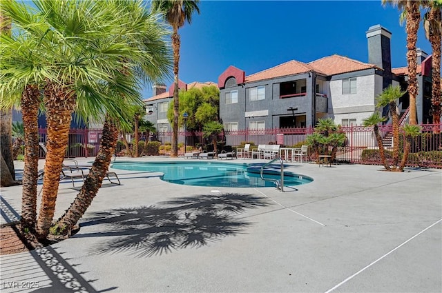 8600 W Charleston Blvd Unit 1059, Las Vegas, NV 89117 - community pool featuring a patio area