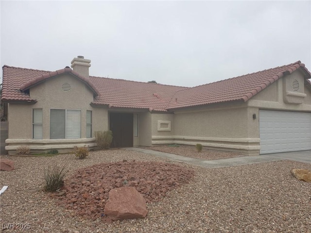 3116 Gentle Breeze St, Las Vegas, NV 89108 - view of front of home with stucco siding, a tile roof, a garage, and concrete driveway
