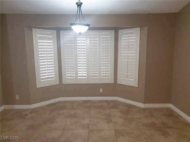 3116 Gentle Breeze St, Las Vegas, NV 89108 - unfurnished dining area featuring light tile patterned flooring and baseboards