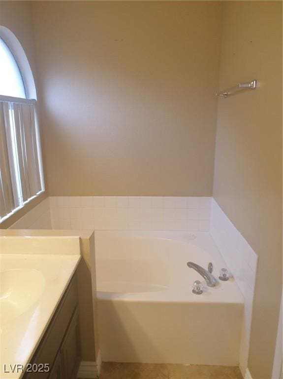 3116 Gentle Breeze St, Las Vegas, NV 89108 - bathroom featuring vanity, a garden tub, and tile patterned flooring