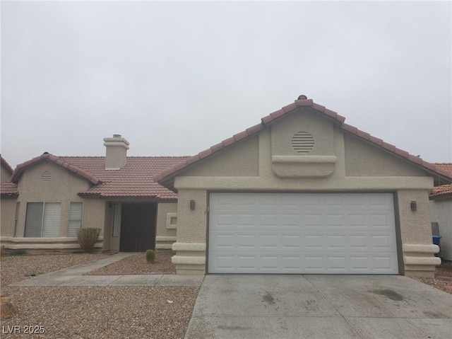 3116 Gentle Breeze St, Las Vegas, NV 89108 - view of front of property with a tile roof, stucco siding, concrete driveway, and a garage