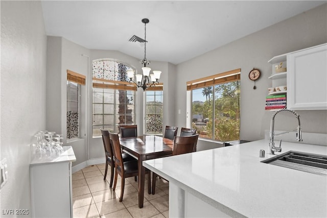 2512 Huber Heights Dr, Las Vegas, NV 89128 - dining space featuring a chandelier and light tile patterned floors