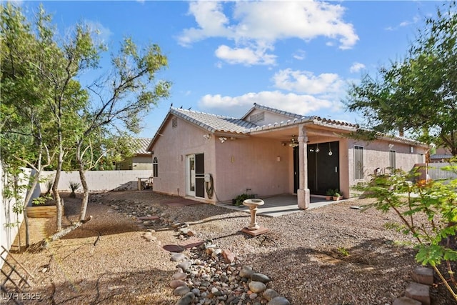 2512 Huber Heights Dr, Las Vegas, NV 89128 - rear view of house with a patio area, a tile roof, and stucco siding