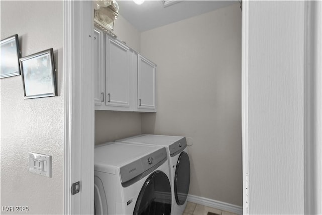 2512 Huber Heights Dr, Las Vegas, NV 89128 - laundry room featuring washing machine and dryer, cabinet space, and light tile patterned flooring