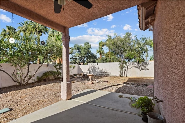 2512 Huber Heights Dr, Las Vegas, NV 89128 - fenced backyard with a patio and ceiling fan