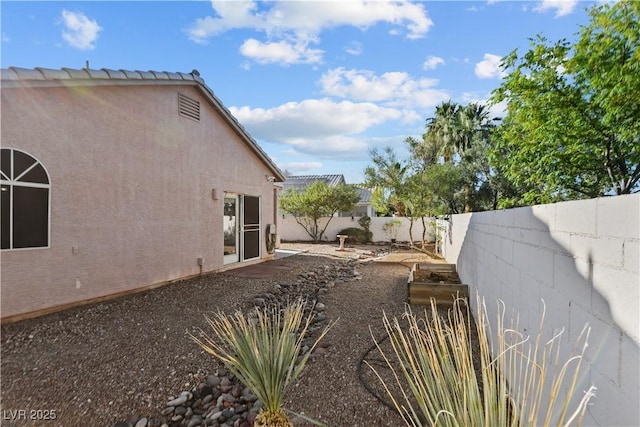2512 Huber Heights Dr, Las Vegas, NV 89128 - fenced backyard with a garden