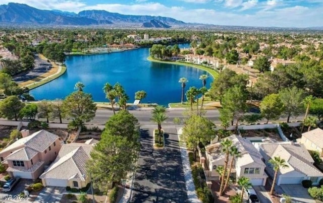 2512 Huber Heights Dr, Las Vegas, NV 89128 - aerial perspective of suburban area with a water and mountain view