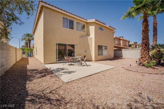 9604 Summer Cypress St, Las Vegas, NV 89123 - rear view of house with stucco siding, a tiled roof, a fenced backyard, and a patio