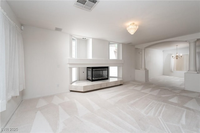 9604 Summer Cypress St, Las Vegas, NV 89123 - unfurnished living room with a fireplace, carpet flooring, ornate columns, and arched walkways